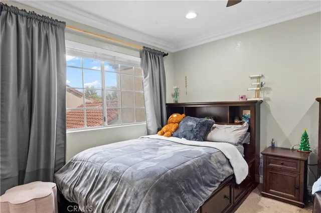 a bedroom with a bed and window