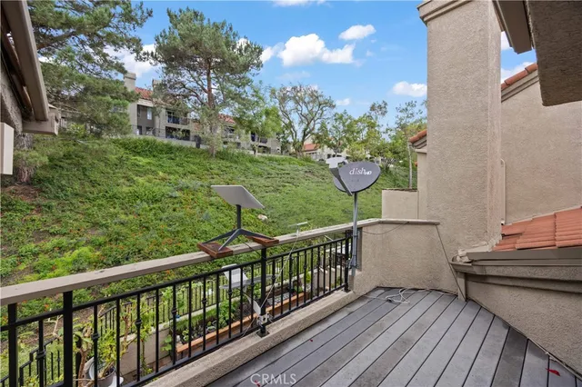 a view of a two chairs on the roof deck