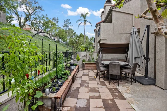 a view of a tables and chairs in patio