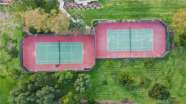 a view of a red and white building with a yard