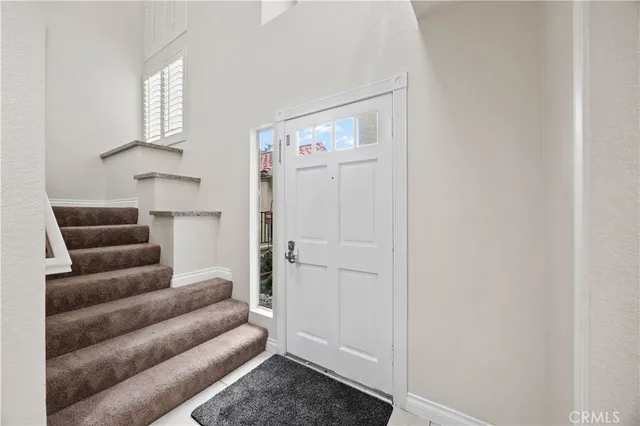 a living room with furniture and a walk in closet