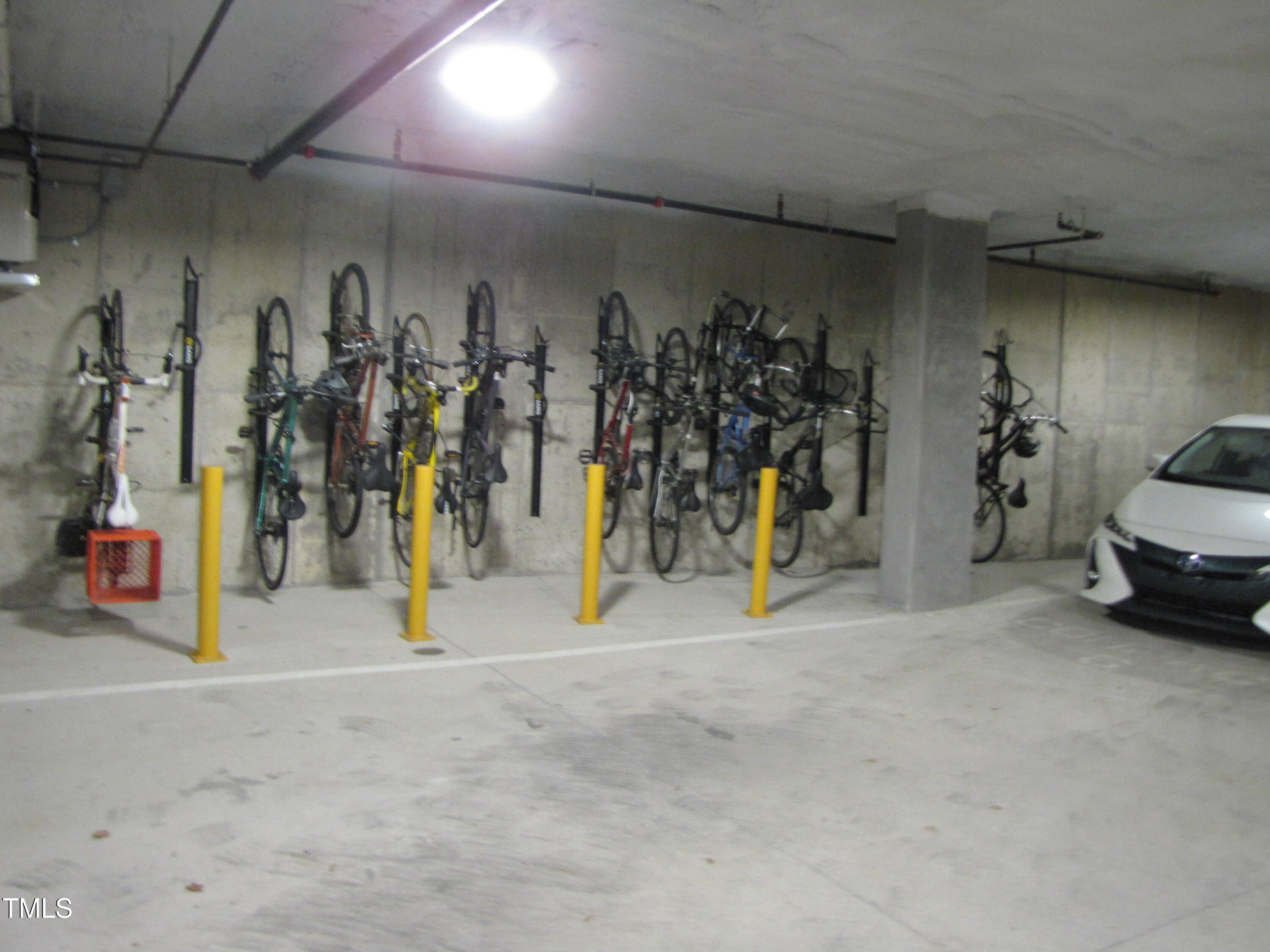 600 South Duke Street, Unit 23 Durham, NC 27701 - Photo 18 of 19 a view of a garage with a bike and car