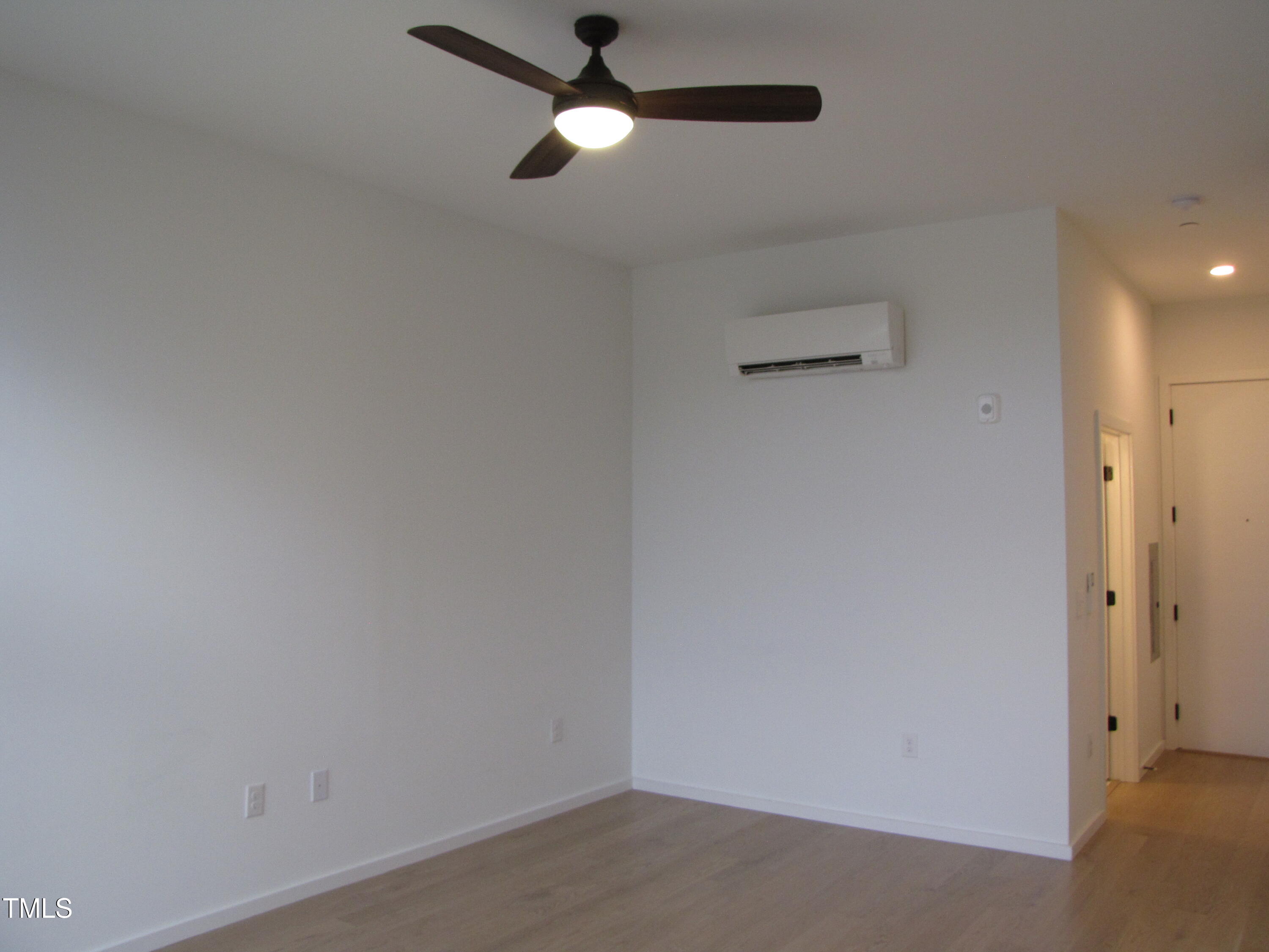 600 South Duke Street, Unit 23 Durham, NC 27701 - Photo 5 of 19 an empty room with a ceiling fan and a window