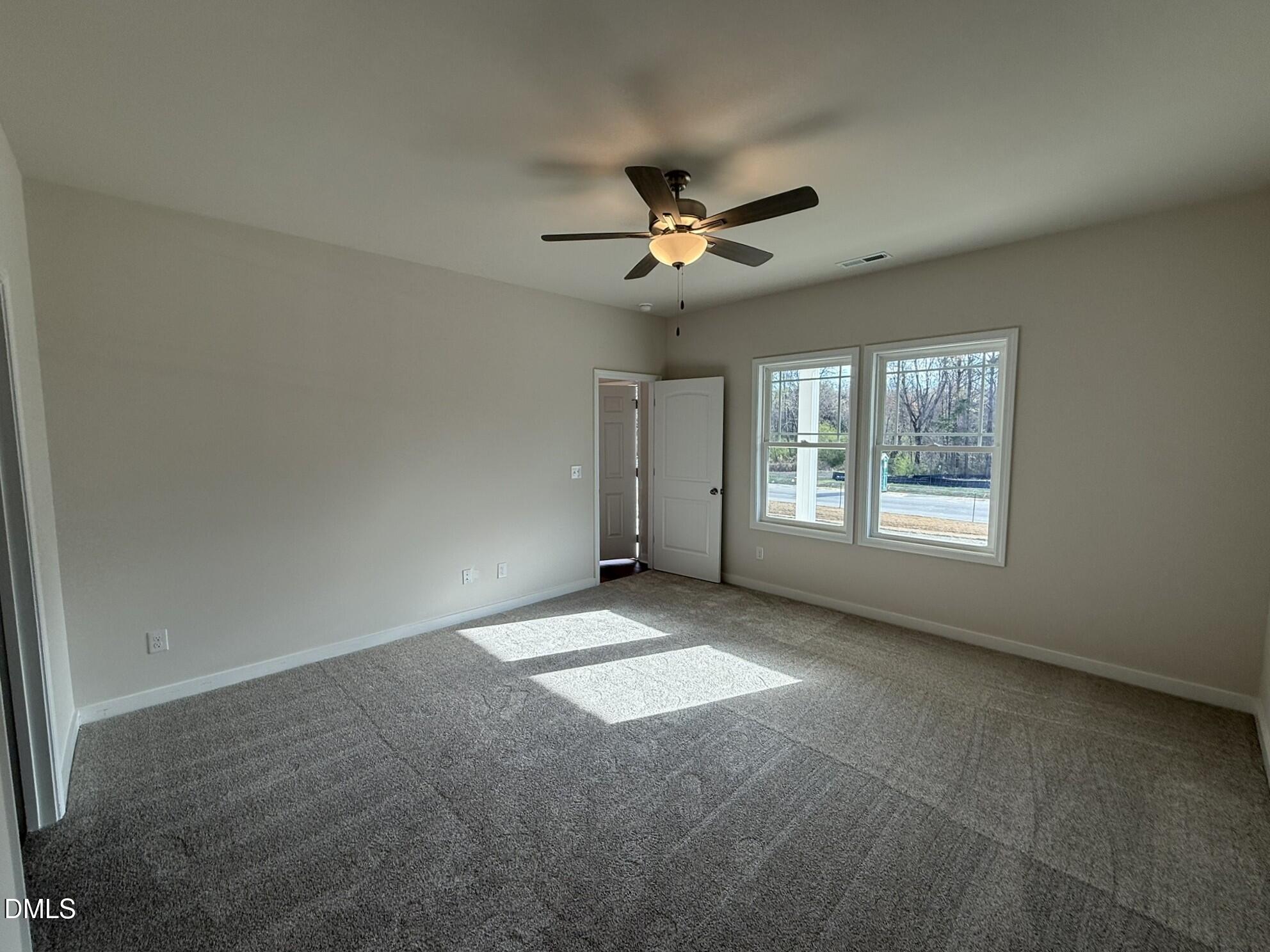 129 Jacobs Ridge Drive Four Oaks, NC 27524 - Photo 11 of 18 a view of n empty room with a window