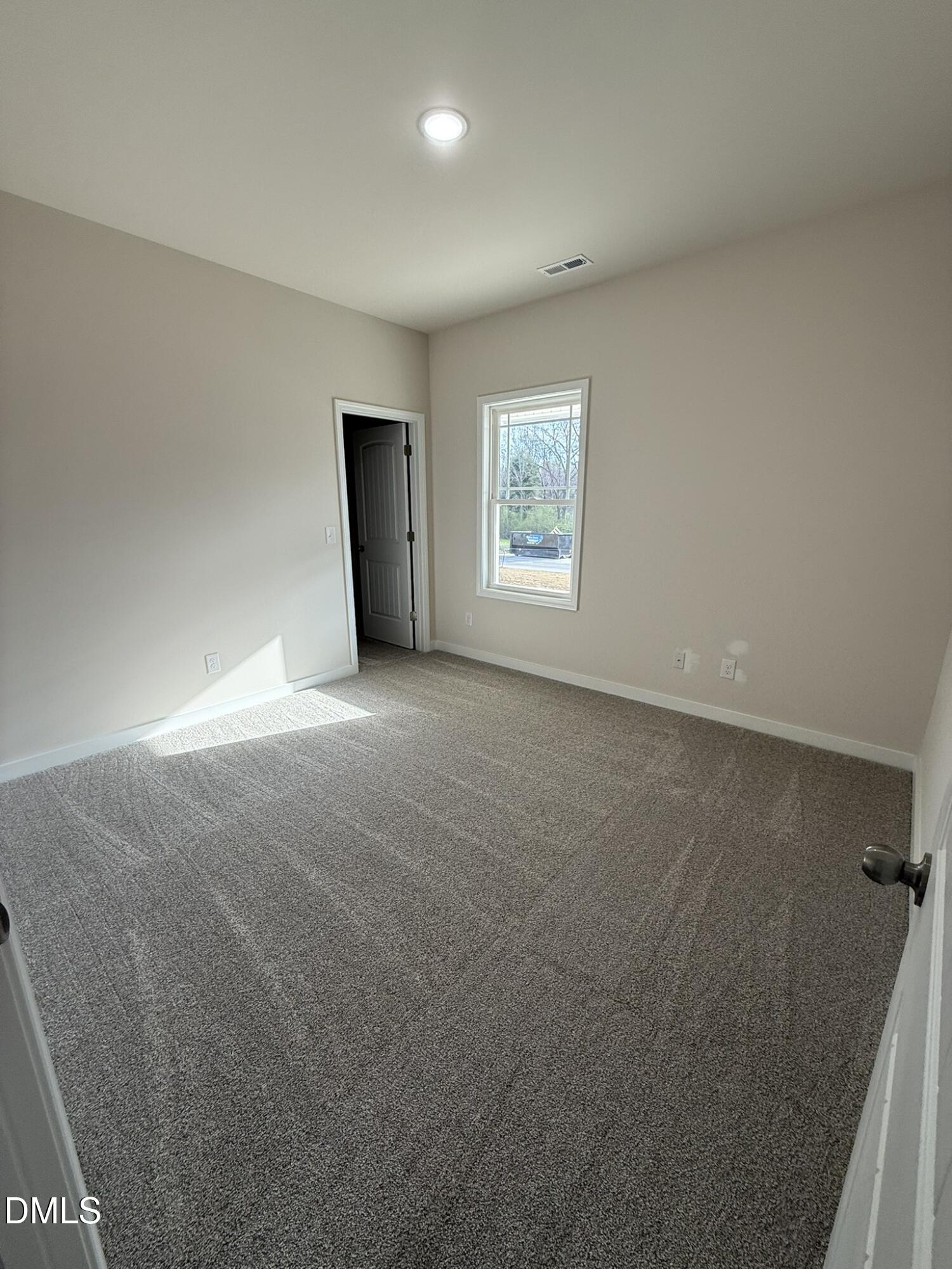129 Jacobs Ridge Drive Four Oaks, NC 27524 - Photo 15 of 18 an empty room with windows