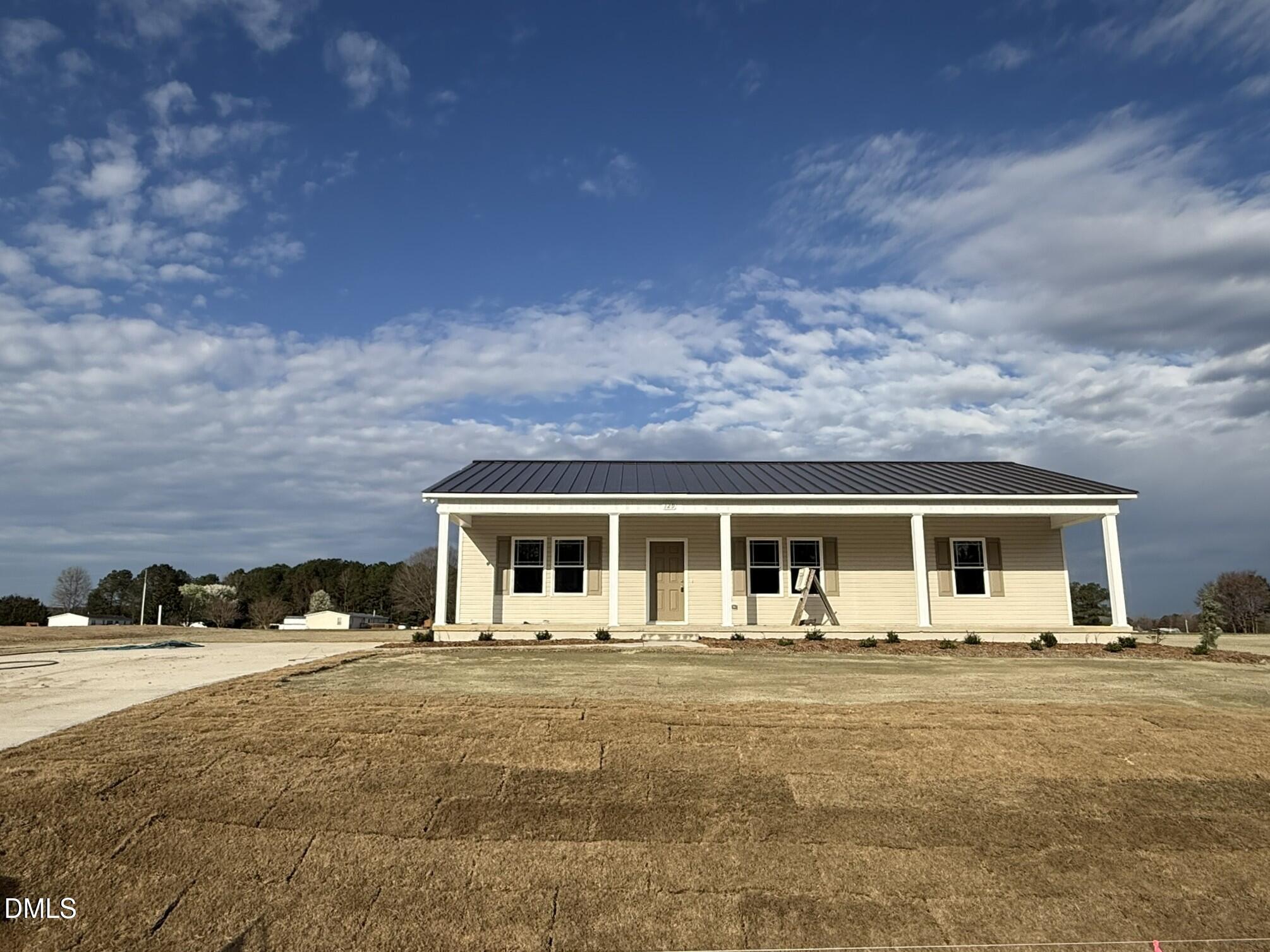 129 Jacobs Ridge Drive Four Oaks, NC 27524 - Photo 2 of 18 a view of a house with a patio