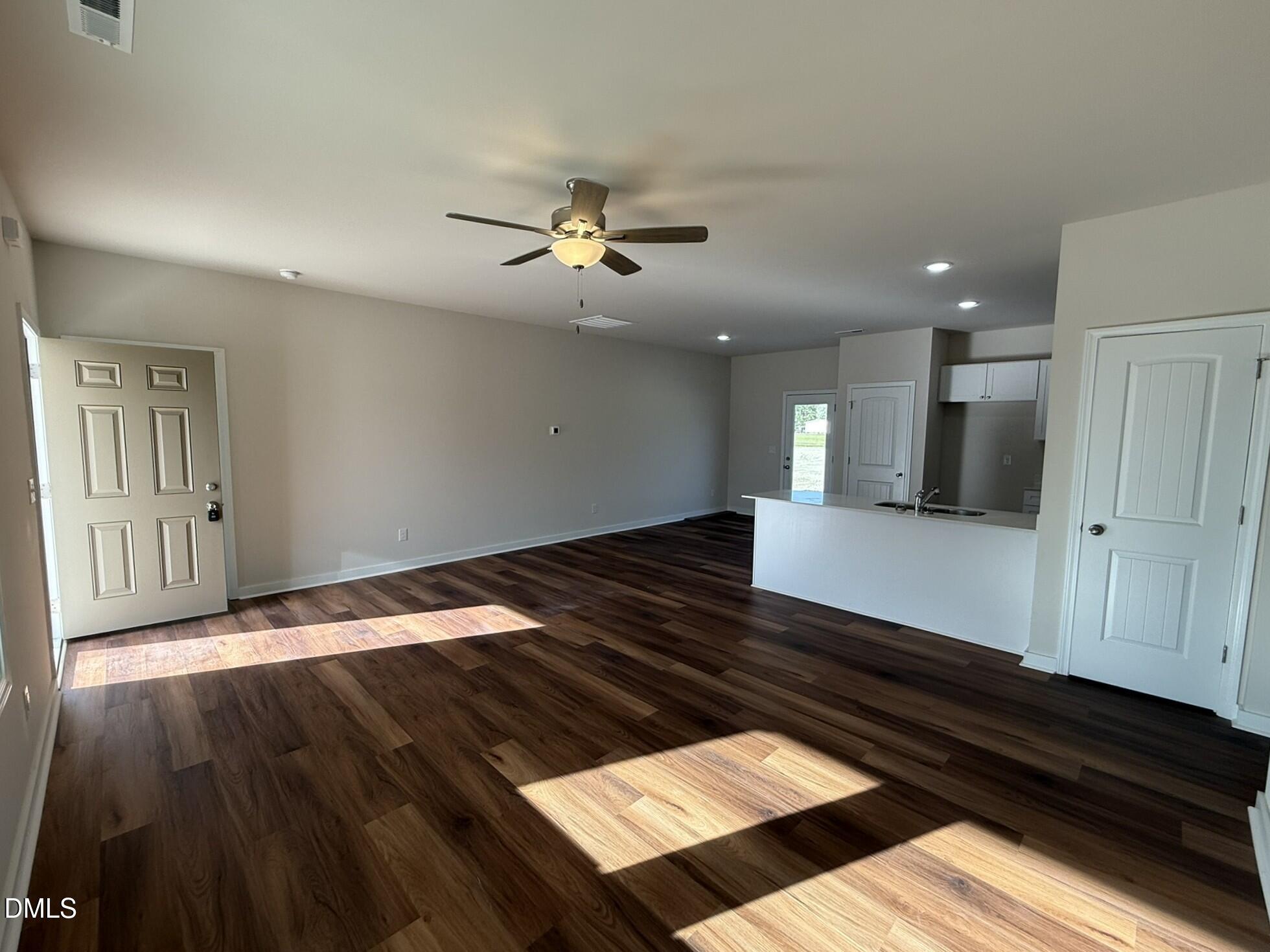 129 Jacobs Ridge Drive Four Oaks, NC 27524 - Photo 6 of 18 a view of an empty room and wooden floor