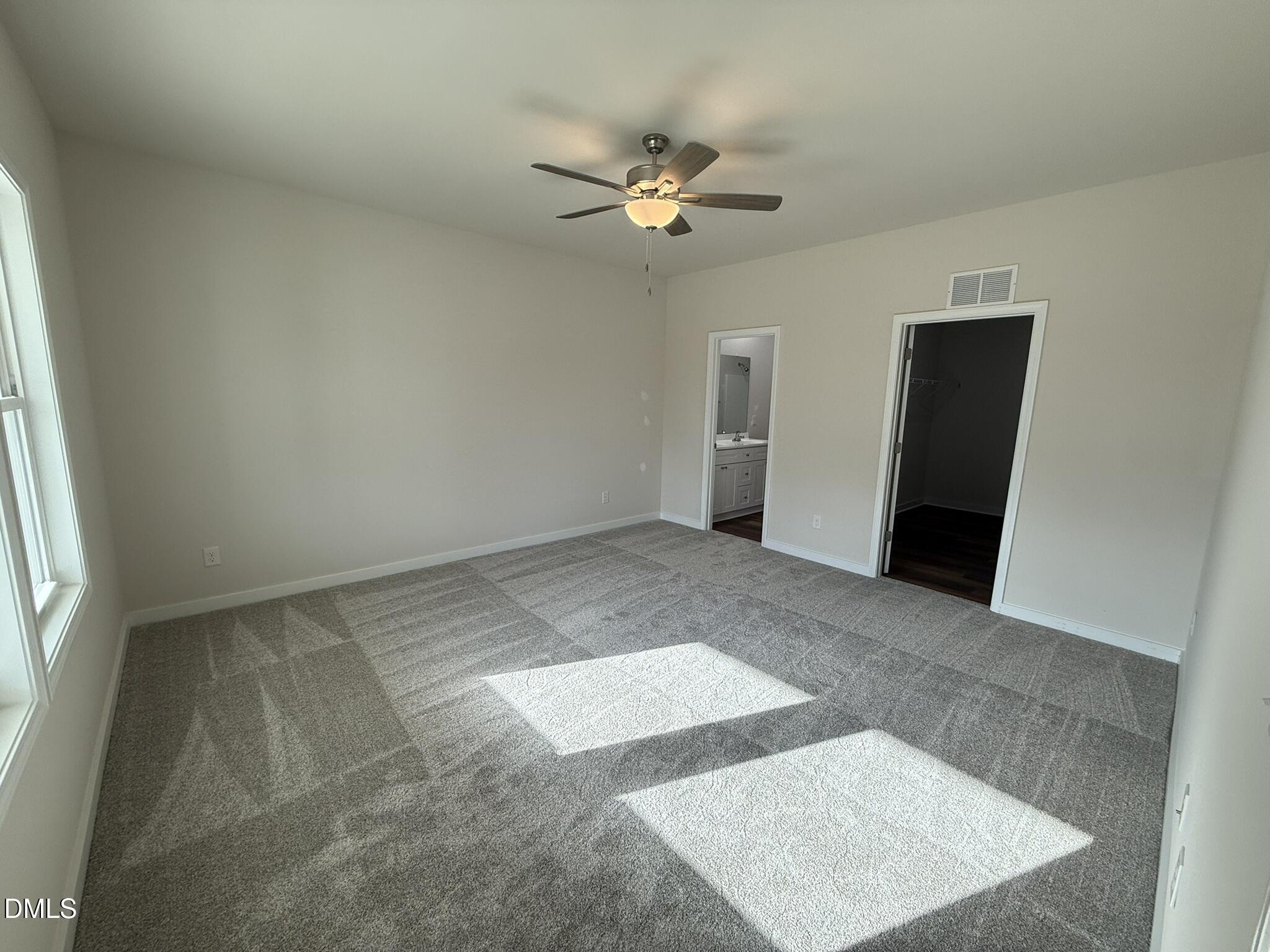 129 Jacobs Ridge Drive Four Oaks, NC 27524 - Photo 10 of 18 a view of a big room with wooden floor and windows