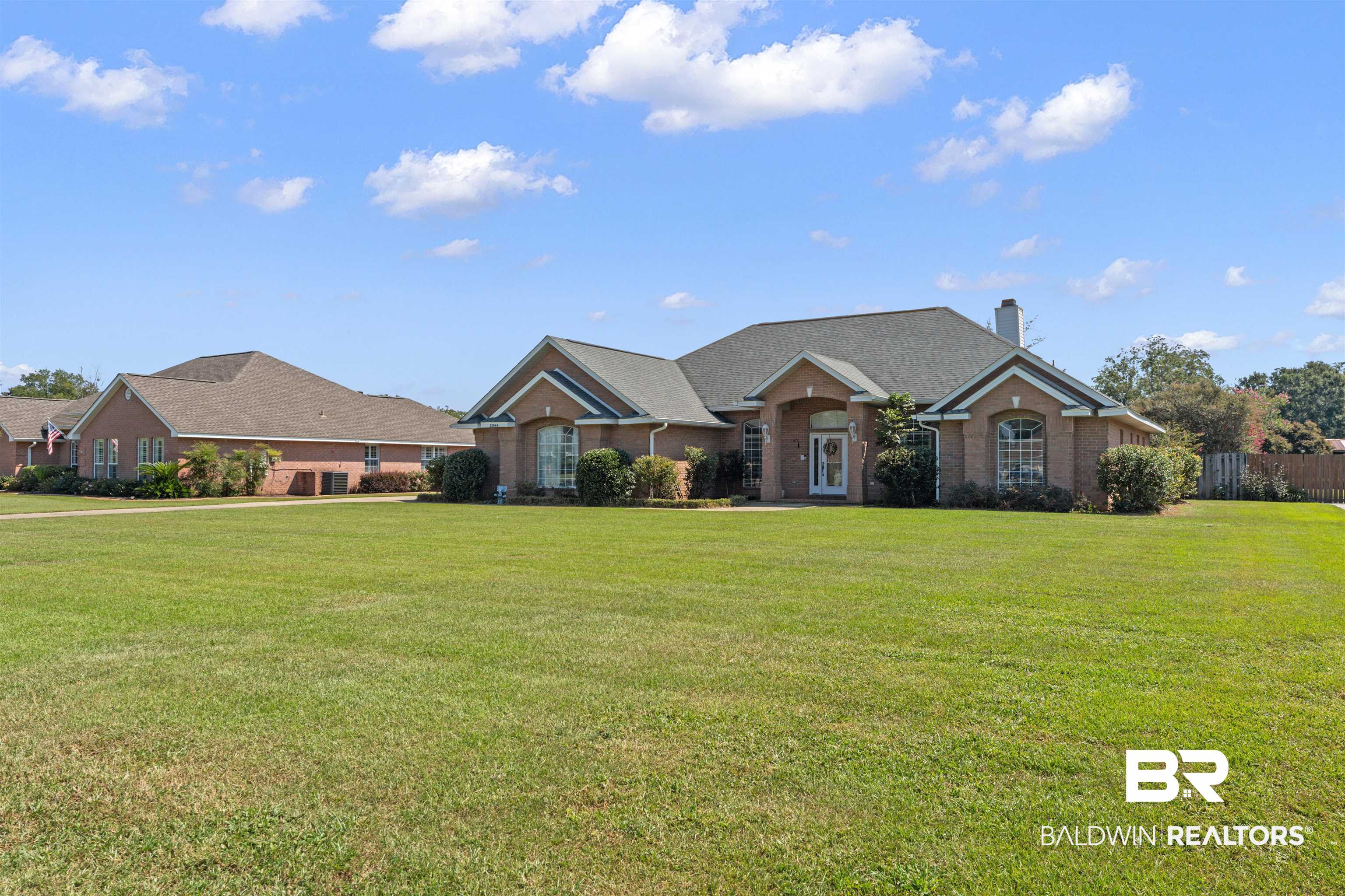 12664 Hunters Chase Foley, AL 36535 - Photo 61 of 62 Ranch-style house with a front yard, a chimney, and brick siding