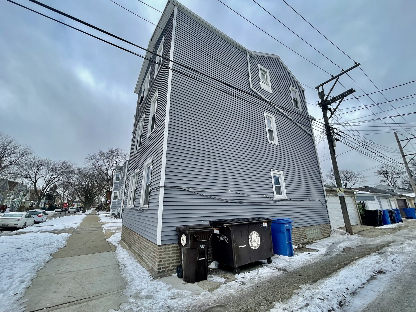 4155 West Roscoe Street Chicago, IL 60641 - Photo 11 of 11 a view of a house with a yard