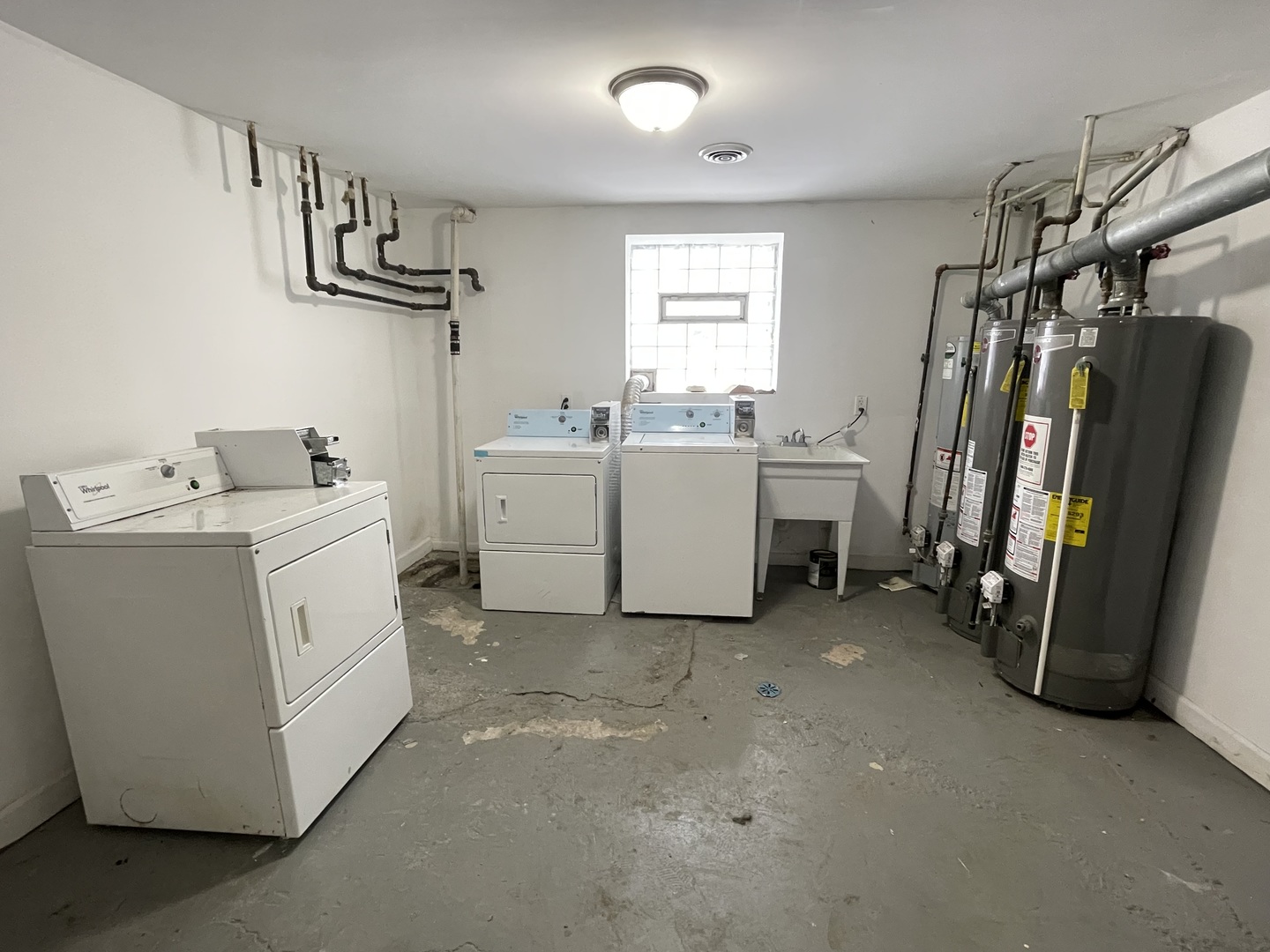 4155 West Roscoe Street Chicago, IL 60641 - Photo 5 of 11 a utility room with cabinets dryer and washer