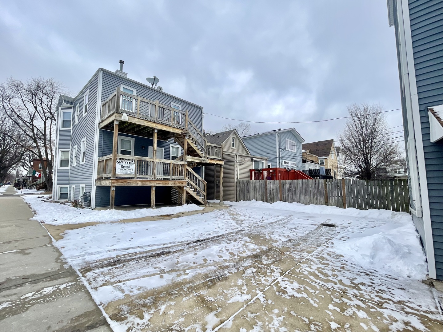4155 West Roscoe Street Chicago, IL 60641 - Photo 6 of 11 a view of a house with a yard