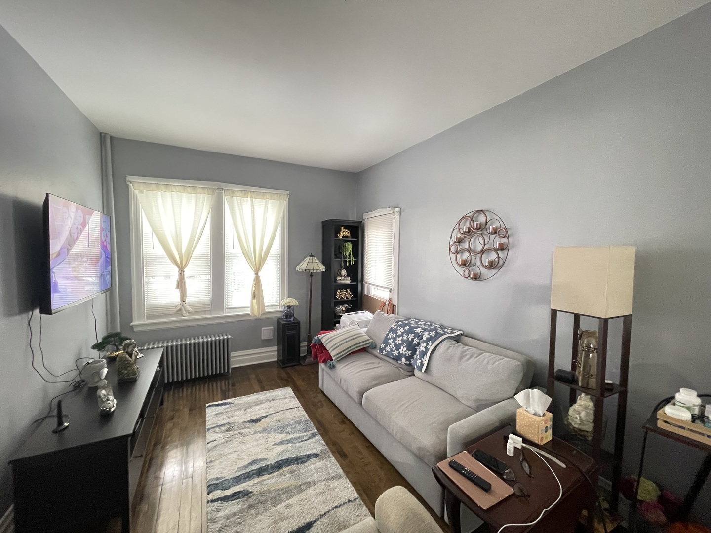 4155 West Roscoe Street Chicago, IL 60641 - Photo 10 of 11 a living room with furniture and a flat screen tv