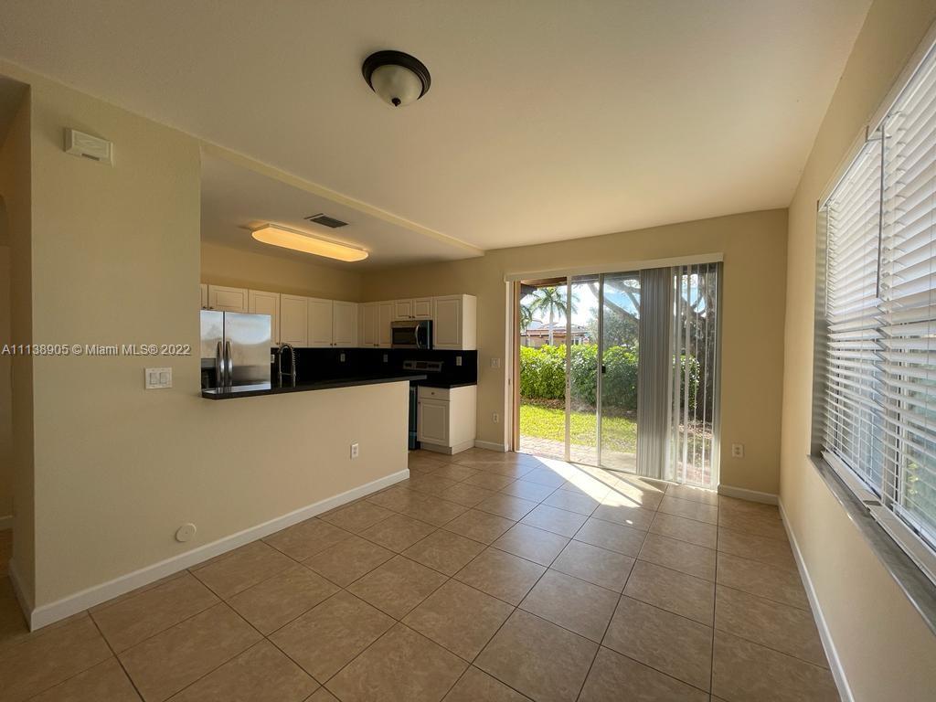 9323 Southwest 227th Street, Unit 75 Cutler Bay, FL 33190 - Photo 16 of 44 a view of an empty room and window