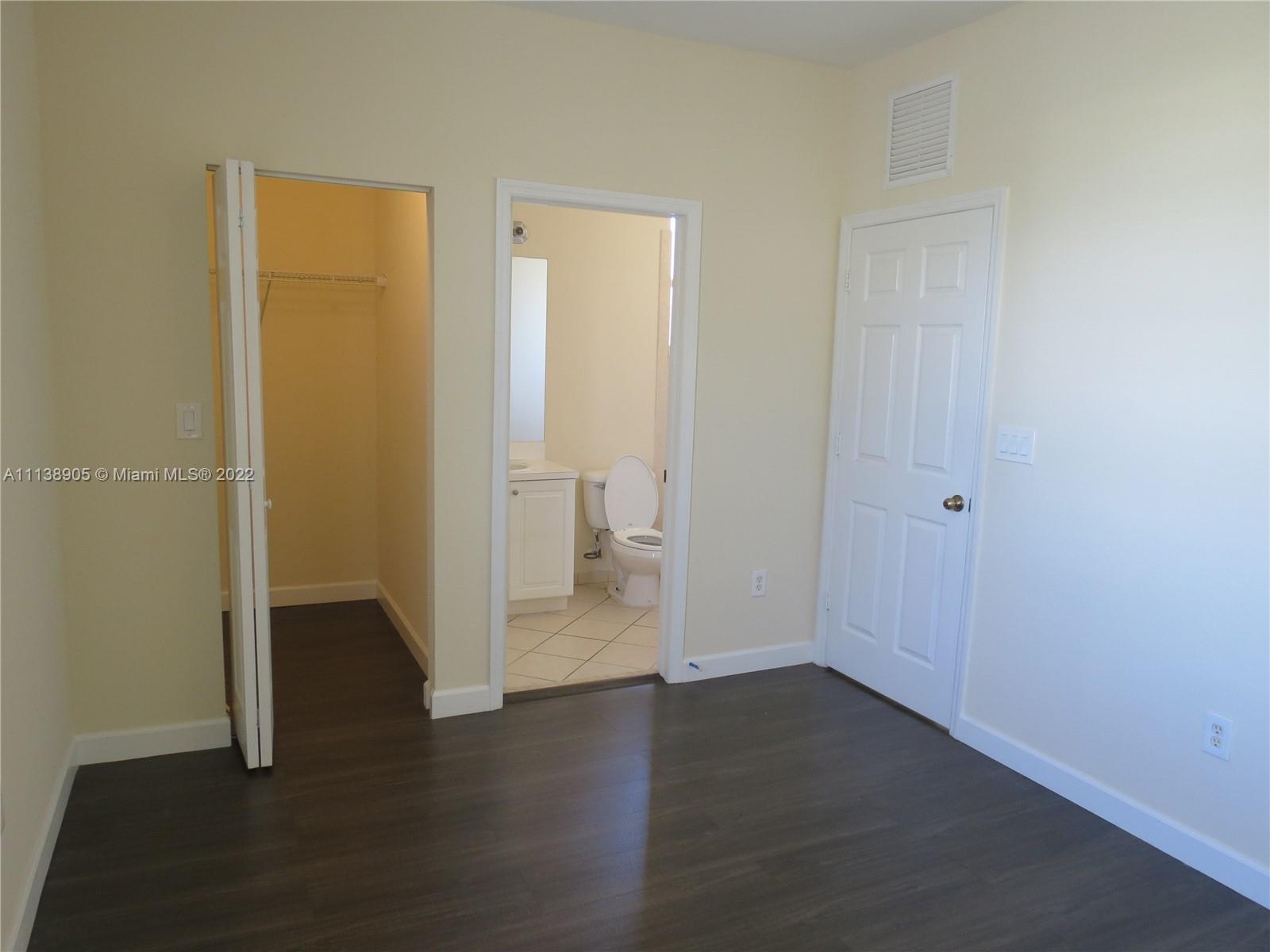 9323 Southwest 227th Street, Unit 75 Cutler Bay, FL 33190 - Photo 24 of 44 wooden floor in an empty room