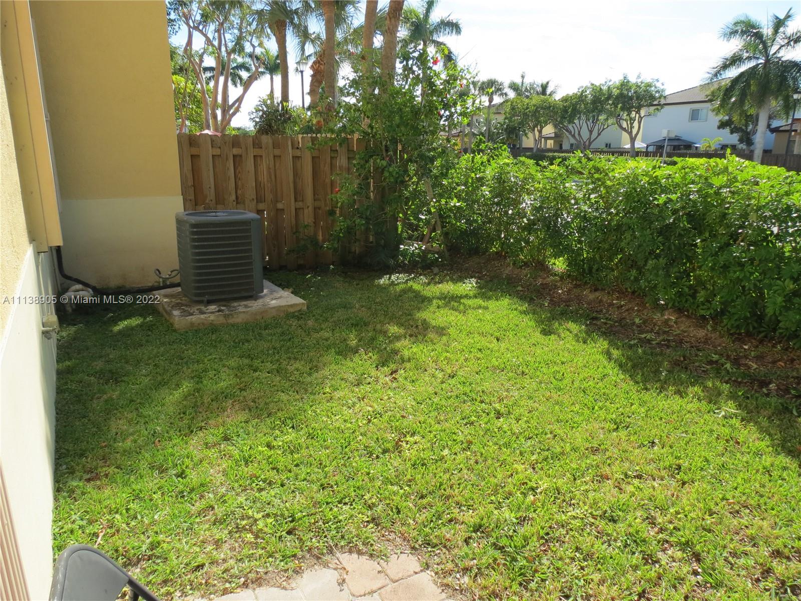 9323 Southwest 227th Street, Unit 75 Cutler Bay, FL 33190 - Photo 36 of 44 a view of outdoor space and yard