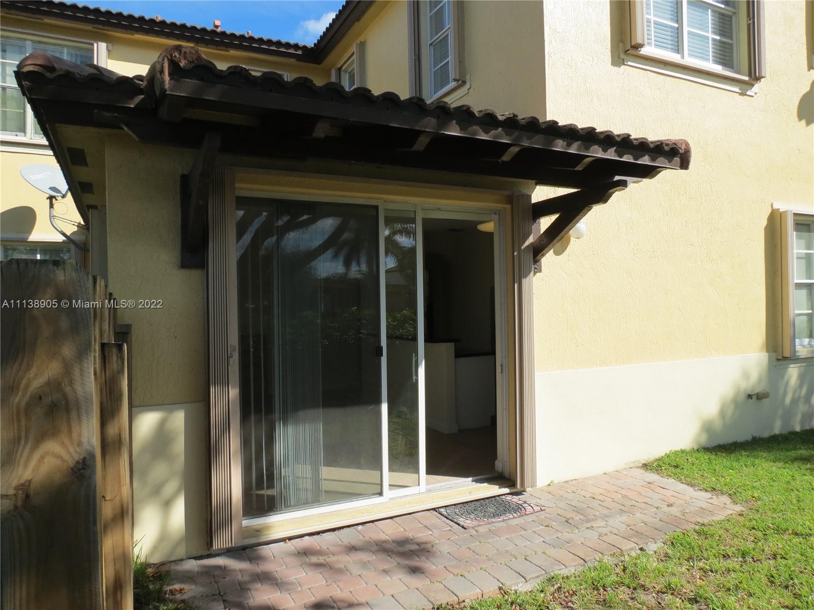9323 Southwest 227th Street, Unit 75 Cutler Bay, FL 33190 - Photo 37 of 44 a view of a wooden door