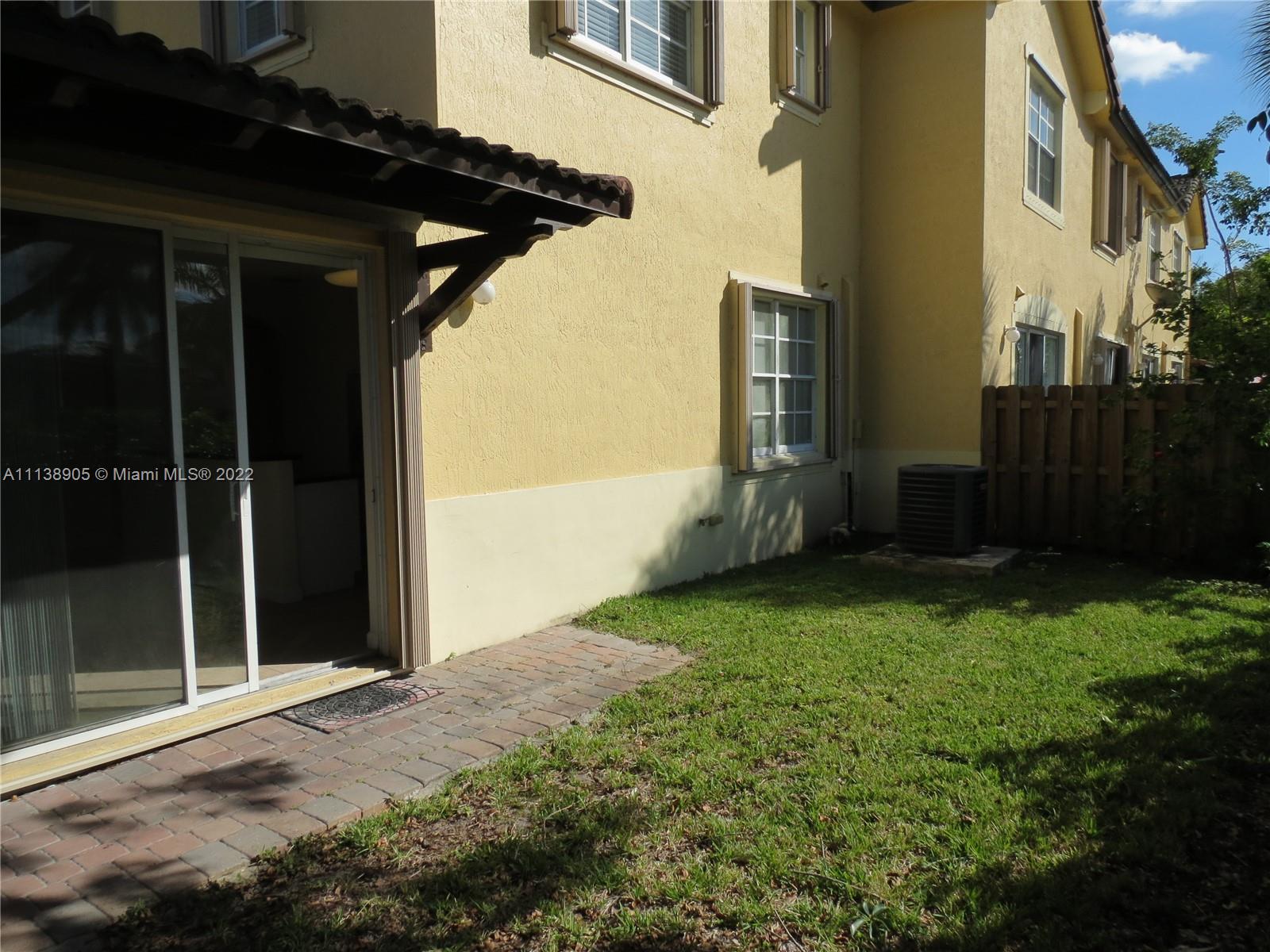 9323 Southwest 227th Street, Unit 75 Cutler Bay, FL 33190 - Photo 38 of 44 a view of backyard with cabin