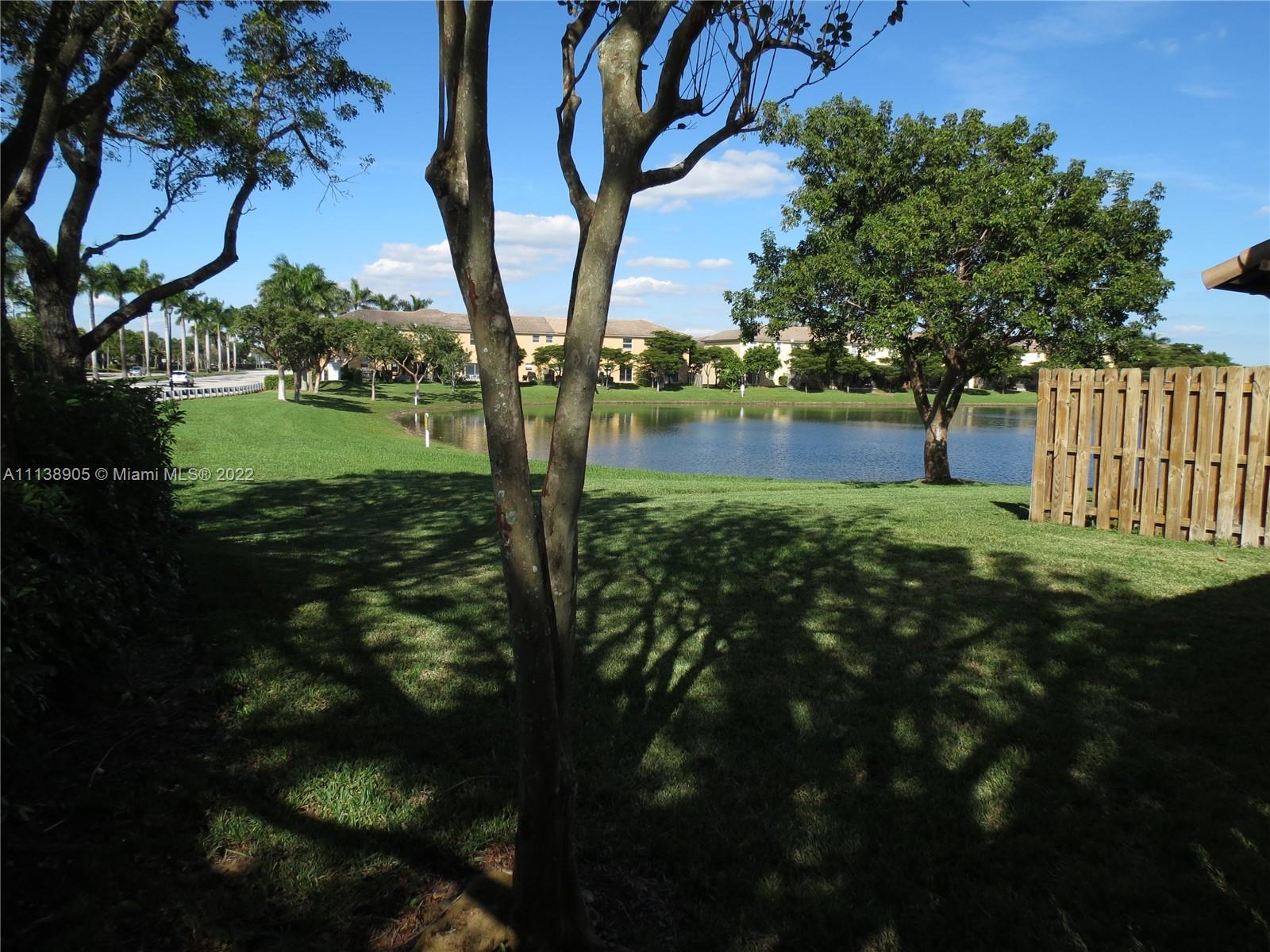 9323 Southwest 227th Street, Unit 75 Cutler Bay, FL 33190 - Photo 39 of 44 a view of backyard with green space