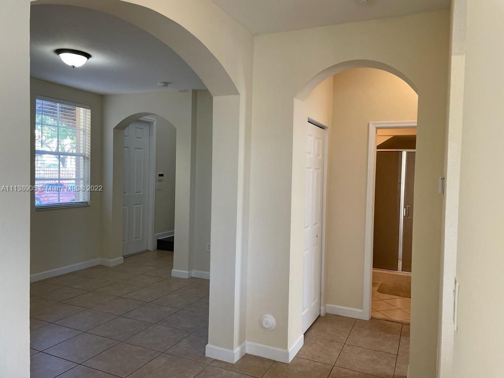 9323 Southwest 227th Street, Unit 75 Cutler Bay, FL 33190 - Photo 7 of 44 a view of an entryway door
