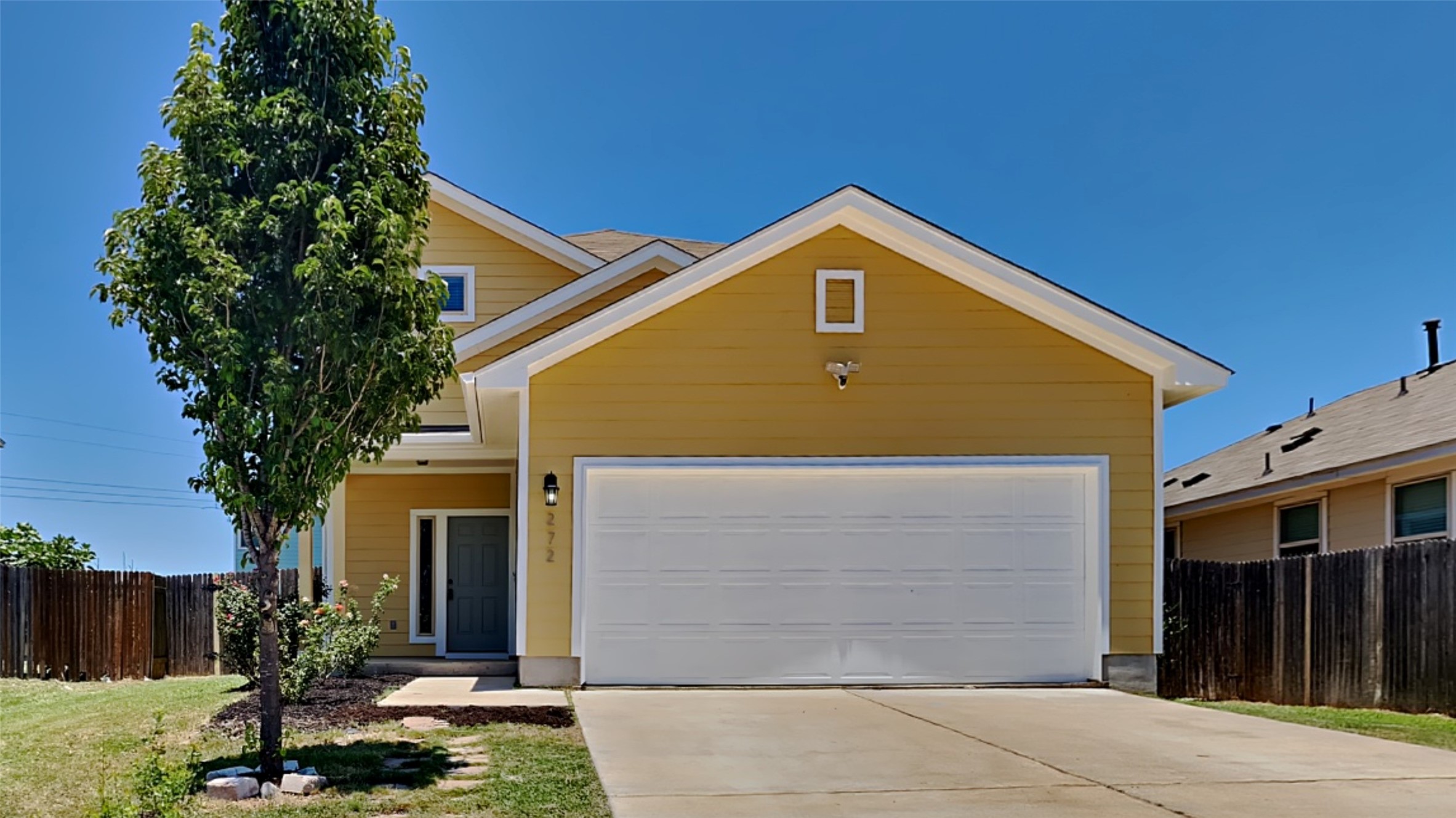 272 Triumph Road Buda, TX 78610 - Photo 1 of 1 a front view of a house with a yard
