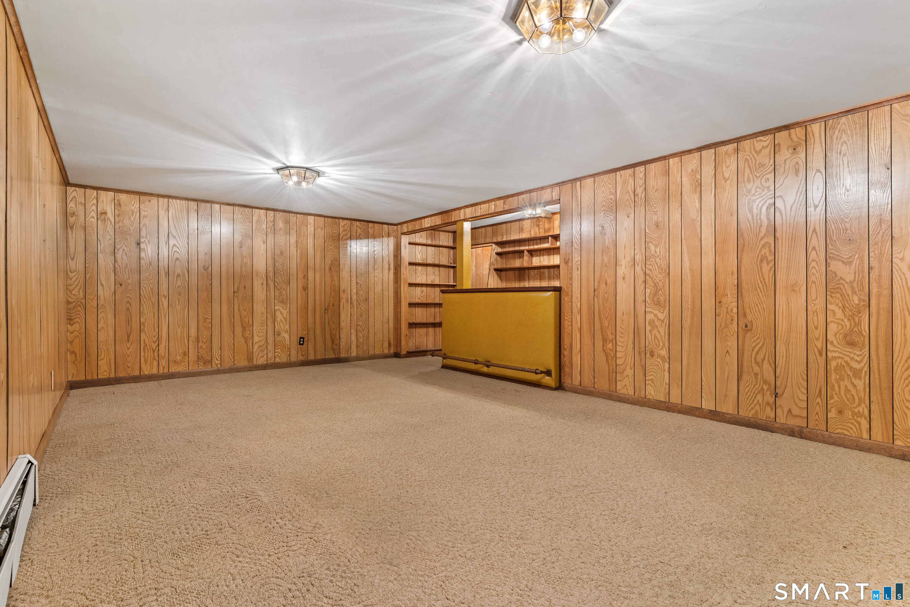 251 Shelter Rock Road Fairfield, CT 06825 - Photo 32 of 38 an empty room with a ceiling fan and a window