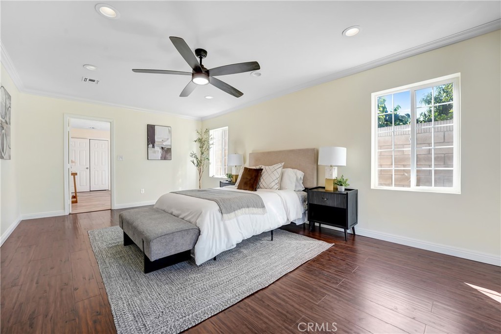 21323 Martin Street Carson, CA 90745 - Photo 12 of 21 a bedroom with a bed and wooden floor