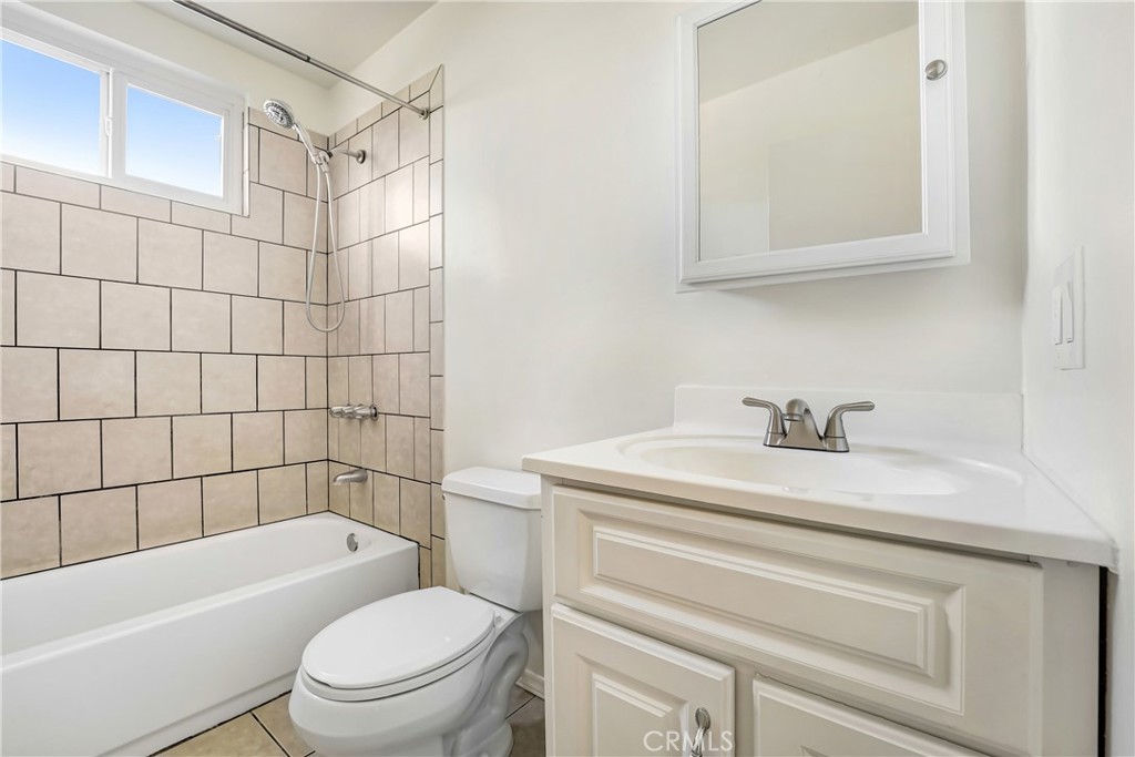 21323 Martin Street Carson, CA 90745 - Photo 17 of 21 a bathroom with a sink a toilet and shower