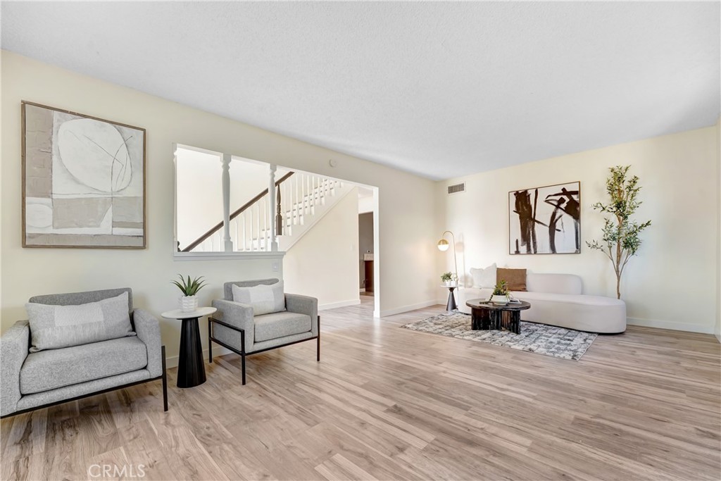 21323 Martin Street Carson, CA 90745 - Photo 2 of 21 a living room with furniture and wooden floor