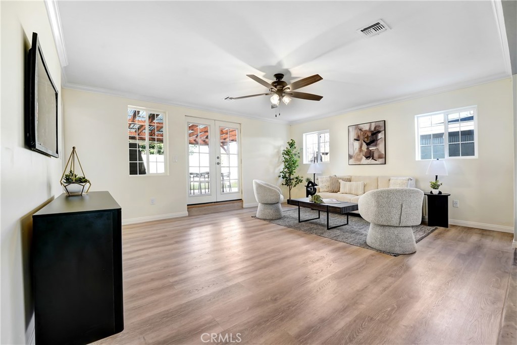 21323 Martin Street Carson, CA 90745 - Photo 7 of 21 a living room with furniture and a wooden floor