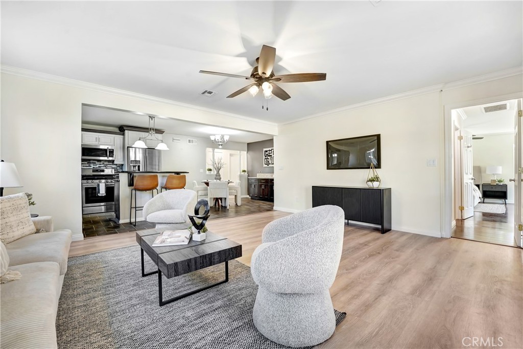 21323 Martin Street Carson, CA 90745 - Photo 8 of 21 a living room with furniture and a wooden floor