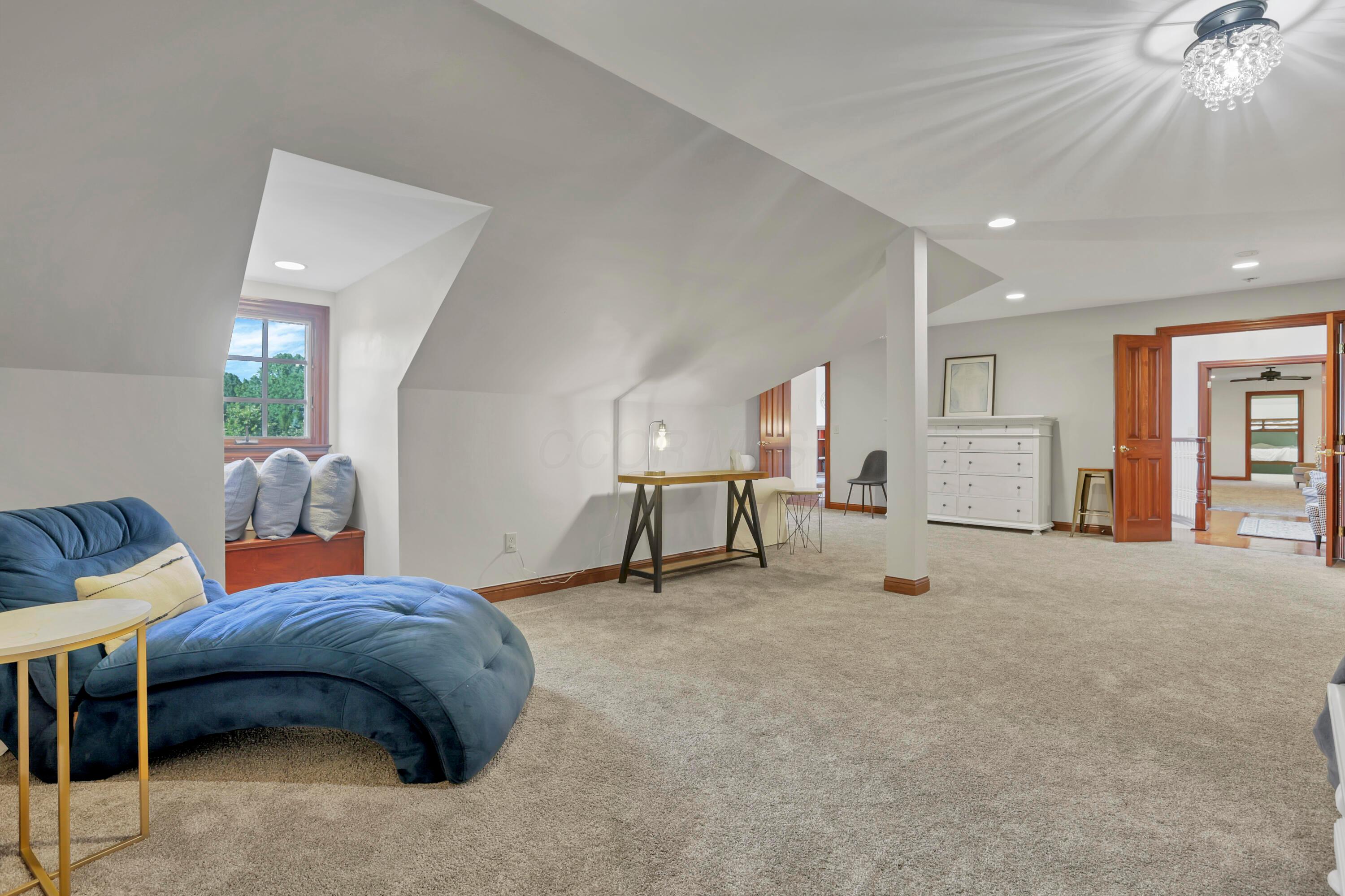 3575 State Rte 37 West Delaware, OH 43015 - Photo 75 of 106 Spacious carpeted room featuring vaulted ceilings, a window seat with a visible exterior, recessed lighting, and a crystal flush mount fixture