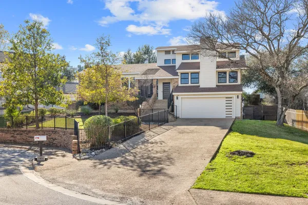 a living room with furniture rug and wooden floor