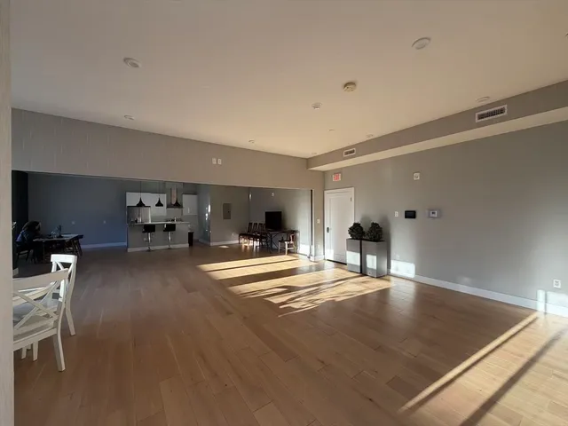a view of a patio with table and chairs with an outdoor space