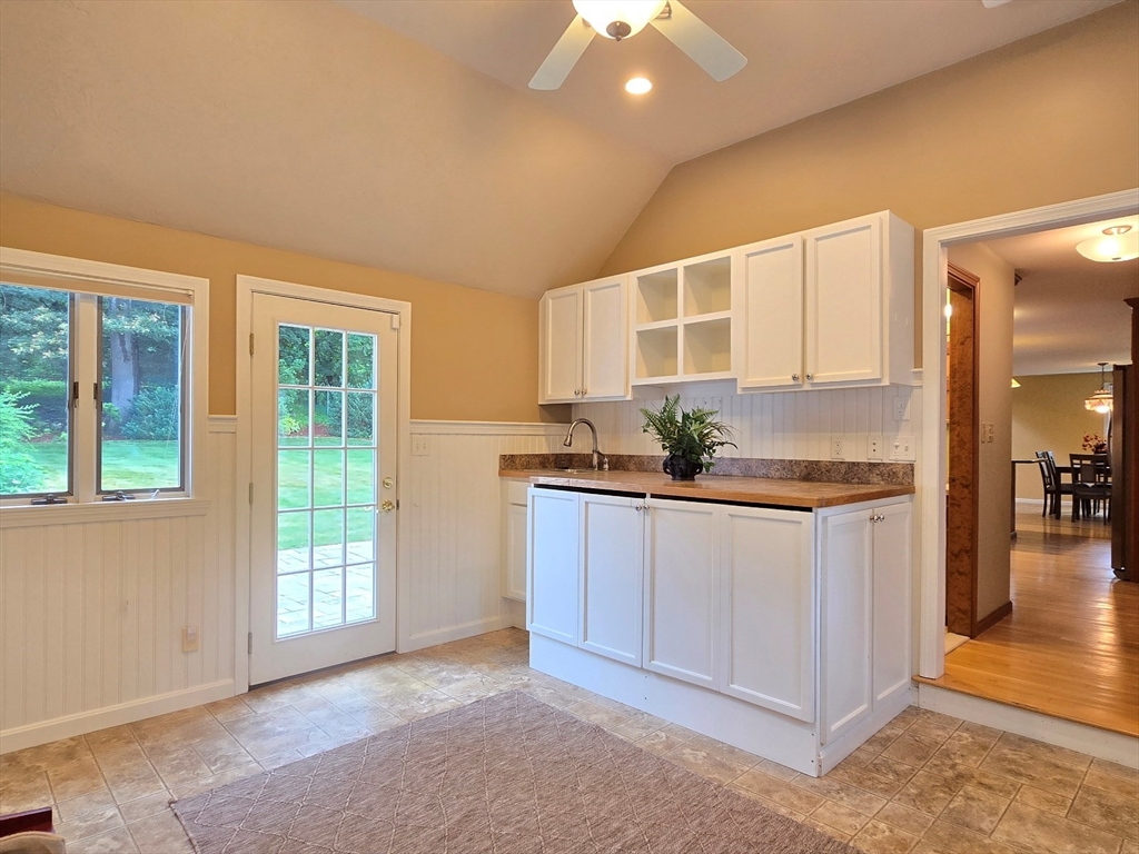 42 Wayside Lane Ashland, MA 01721 - Photo 12 of 40 a kitchen with stainless steel appliances granite countertop a stove a sink and a refrigerator