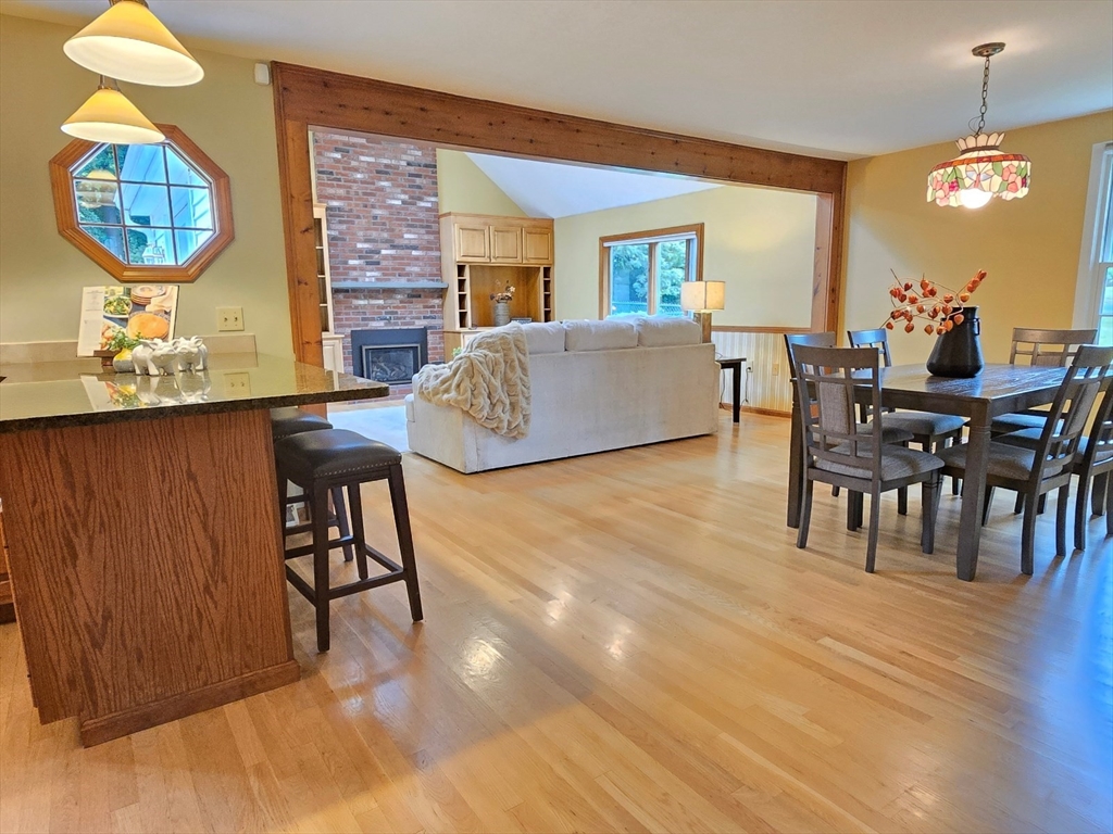 42 Wayside Lane Ashland, MA 01721 - Photo 14 of 40 a living room with furniture a window and a dining table