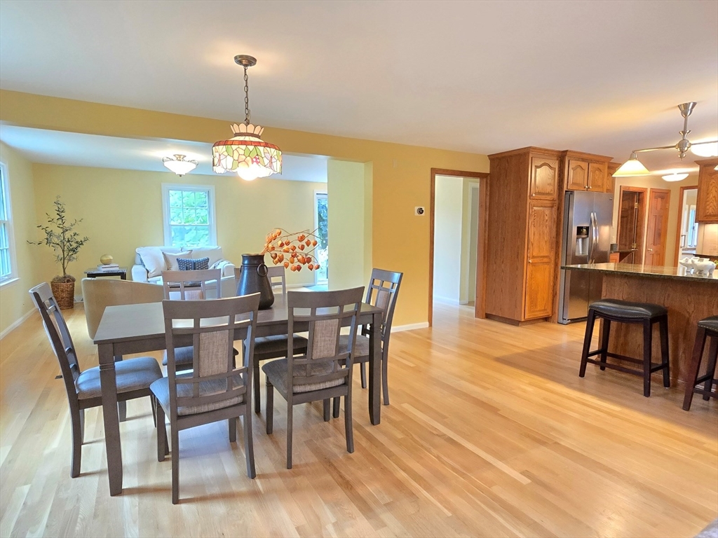 42 Wayside Lane Ashland, MA 01721 - Photo 23 of 40 a view of a dining room with furniture window and wooden floor