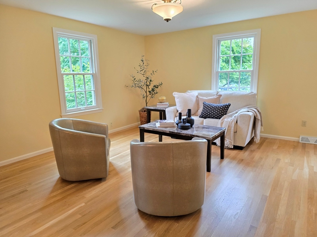 42 Wayside Lane Ashland, MA 01721 - Photo 25 of 40 a living room with furniture and a large window