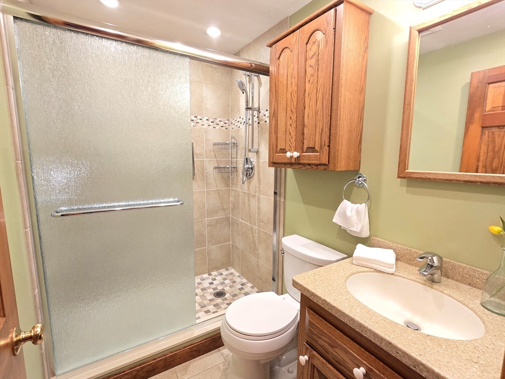 42 Wayside Lane Ashland, MA 01721 - Photo 26 of 40 a bathroom with a sink toilet and shower