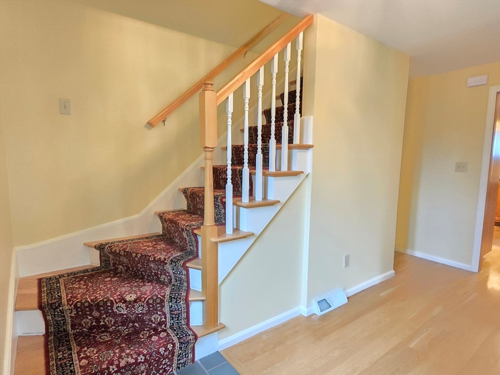 42 Wayside Lane Ashland, MA 01721 - Photo 30 of 40 a view of entryway and hall with wooden floor