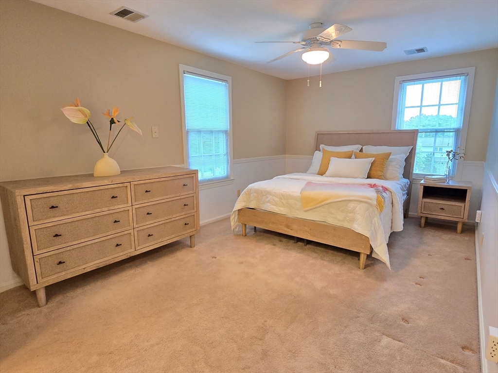 42 Wayside Lane Ashland, MA 01721 - Photo 31 of 40 a spacious bedroom with a bed and window