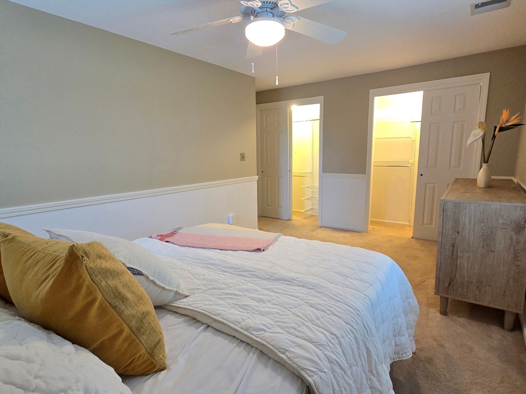 42 Wayside Lane Ashland, MA 01721 - Photo 32 of 40 a bedroom with a bed and a chandelier