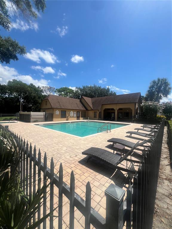 365 Forestway Circle, Unit 307 Altamonte Springs, FL 32701 - Photo 11 of 14 a view of swimming pool with mountain view and seating space