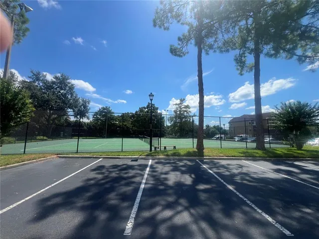 a view of outdoor space with lots of trees and plants