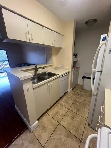 a utility room with cabinets