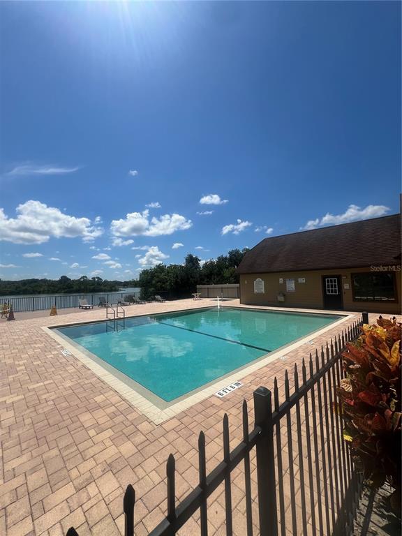 365 Forestway Circle, Unit 307 Altamonte Springs, FL 32701 - Photo 10 of 14 a view of a swimming pool and an outdoor seating