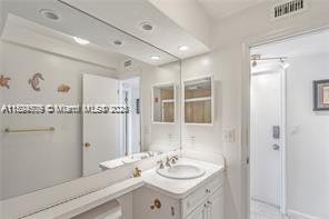 1435 Southeast 15th Street, Unit 103 Fort Lauderdale, FL 33316 - Photo 24 of 33 a bathroom with a sink and a mirror