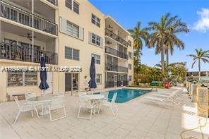 1435 Southeast 15th Street, Unit 103 Fort Lauderdale, FL 33316 - Photo 7 of 33 a view of a building with a patio