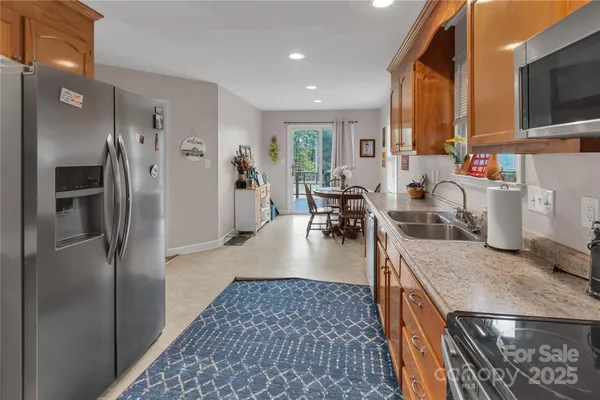 a view of a kitchen with furniture and a window