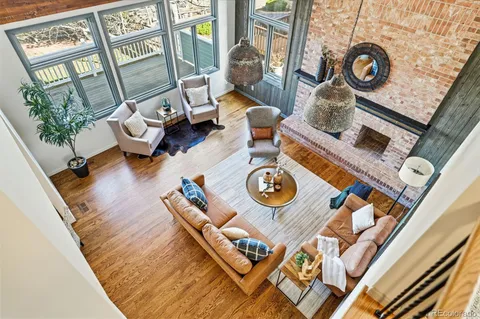 a living room with furniture and next to a window